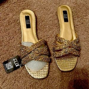 Hello. I am selling a beautiful pair of sparkling gold sandals with silver.
